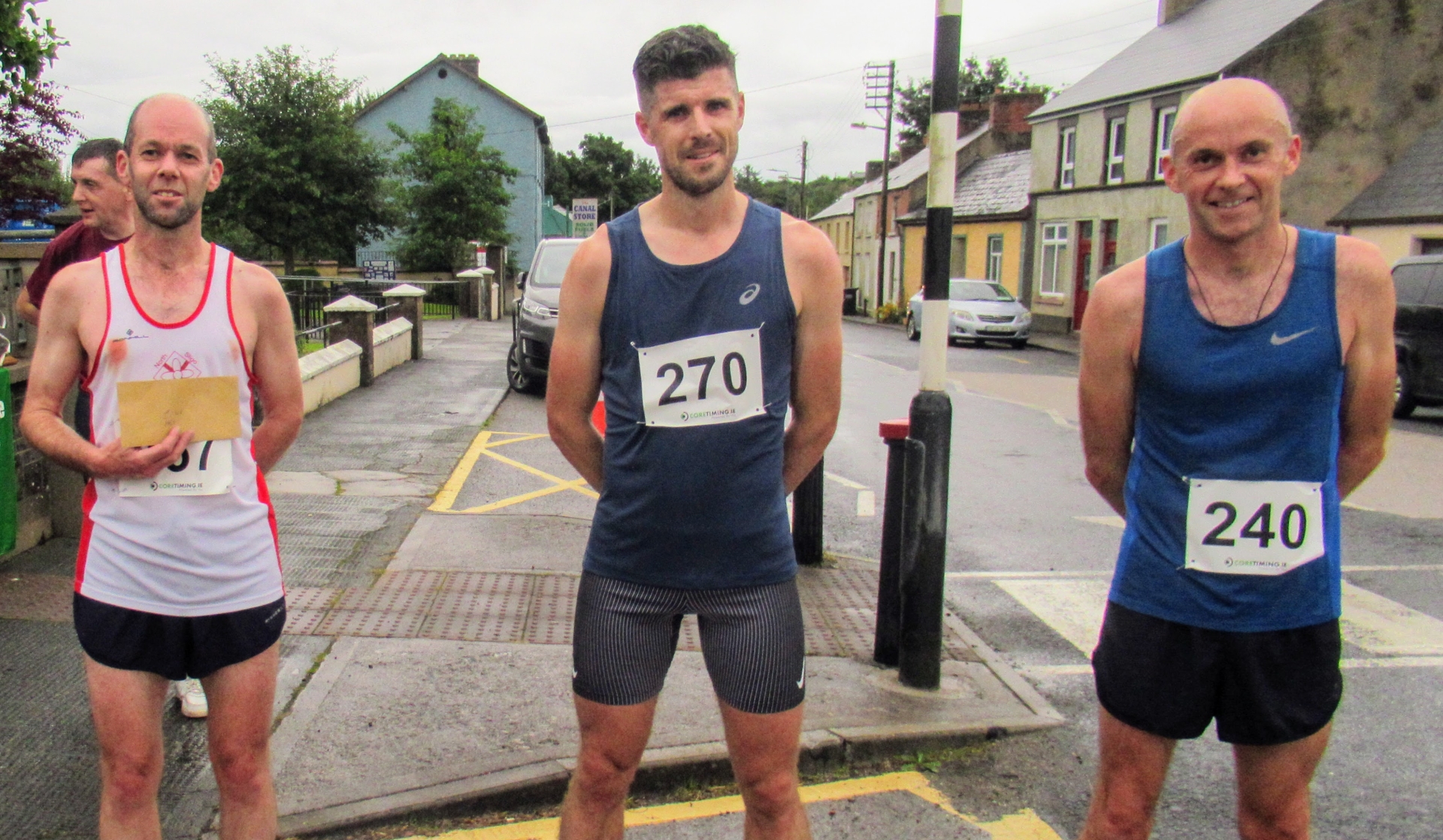 Use to navigate photos   Two of the four course records were broken by substantial margins when the Ballinamore Open 5K and 10K Road Races were run off in unexpectedly benign conditions on Friday evening last.  Sligo AC runner Michael Morgan, one of the leading young runners in the country on the eve of his departure for Providence University on Athletic Scholarship, smashed Alan Kelly of St Ronan’s ten year old 5K record by no less than 95 seconds when coming home in 15.20. He was followed home in third position overall by Kinlough Olympian Breege Connolly who clocked 17.17 to win the Women's race by over three minutes. In the process she shattered the previous figure of 19.43 set by Sharon Grant of Portlaoise in 2016. Ballinamore's Isobel creates history with stunning victory in Seven Sisters Skyline 55 Colin Griffin, although not fully recovered from recent injury, was still able to take the 10K victory for the third successive year after a tough battle with Kevin Donagher of Rathfarnham WSAF over the first 5K.  The Women's race was won by Fiona Gettings of Longford AC. Heavy rain was predicted all week and this was one of the causes of the lower than usual turnout among local runners and joggers. The number of visiting runners kept up as athletes starved of competition over the past eighteen months took the opportunity presented by a choice of two races and despite the fact that covid regulations made many of the arrangements of recent years impossible many were loud in their praise of a race well run. The weather also played a part with the continuous heavy rain not arriving apart from a badly timed shower as the runners took their starting positions. It did not last however and the race was run in conditions free from rain and wind. It is hoped that Ballinamore Family Festival will be back next year and the races will again revert to their position in the week’s programme. UPDATED: Gerard O'Donnell joins Leitrim athletics Olympic list as seven becomes eight Ballinamore Athletic Club are very