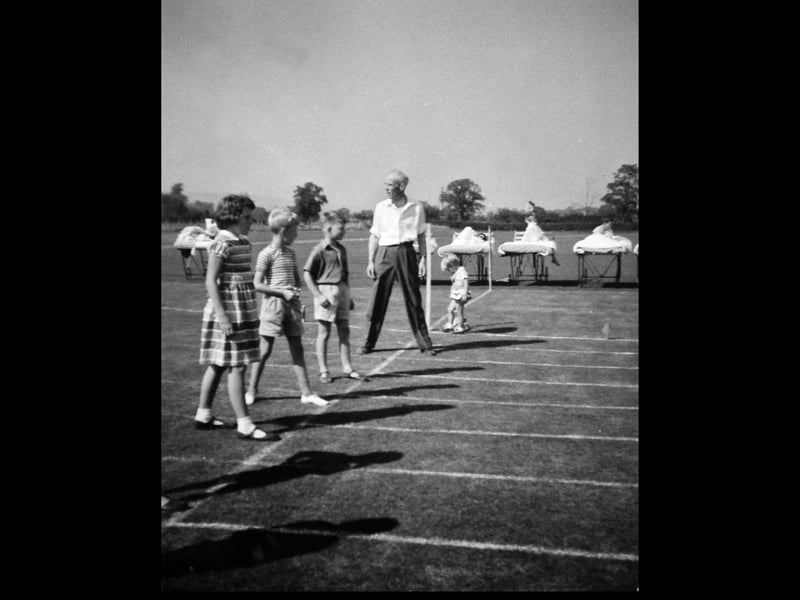 Oswestry 1961: This picture was captured at the Orthopaedic Hospital’s sports day by student nurse Miss Dorothy Franklin, later Mrs Dorothy Roberts. Having arrived from Rushden, Northamptonshire, aged just 17, she was training at the hospital when this moment was recorded. The image also offers a poignant detail of the time, with patients watching from their beds as the event unfolded outside.