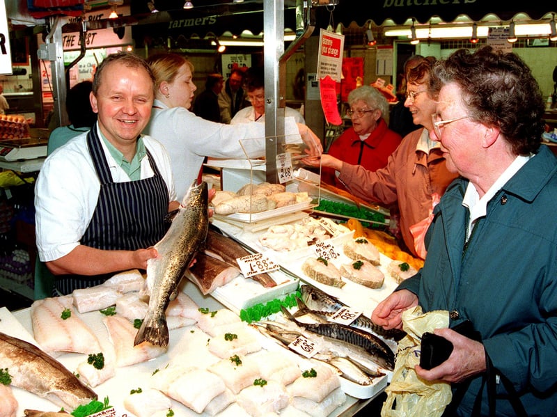 Paul Tissington serves customers at the Tissington and Smith Fish and Poultry stall, Castle Market, Sheffield, in 1999