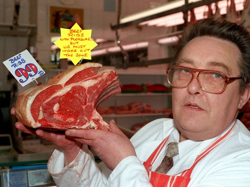Butcher Trevor Middleton  with beef ribs at one of his shops on Butchers Row at Leeds Market in 1997