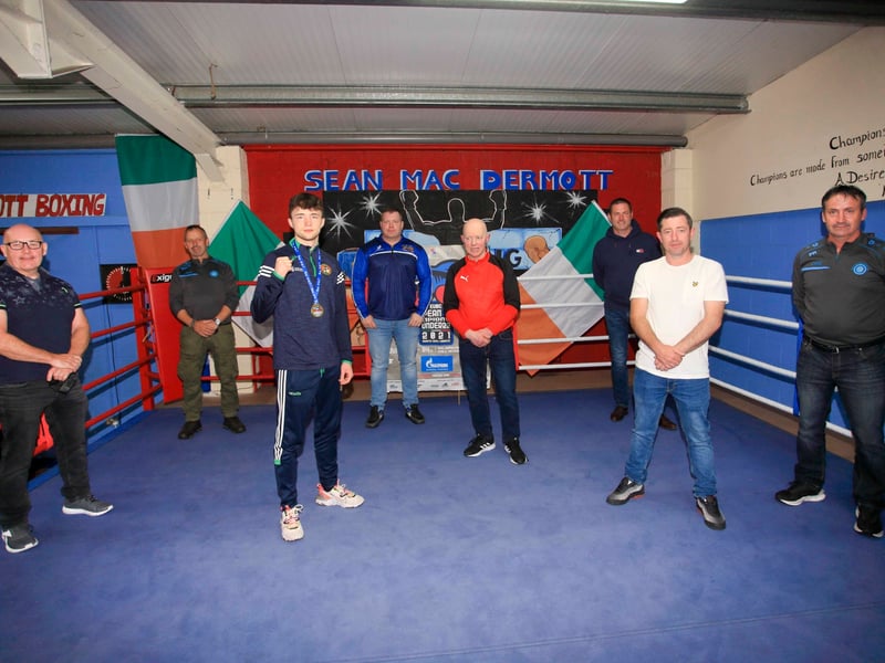 Use > above to go through photos Dean Clancy pictured with coaches and officials from Sean McDermott Boxing Club Picture: James Molloy