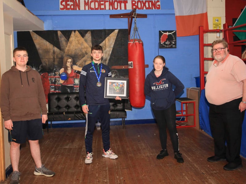 Use > above to go through photos Dean Clancy was presented with a souvenir photograph to mark the occasion by Oisín, Grace and Cllr. Felim Gurn Picture: James Molloy