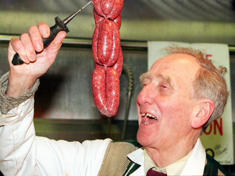 Doncaster market trader Norman Rouse with one of his specialities, venison sausages, in 1999