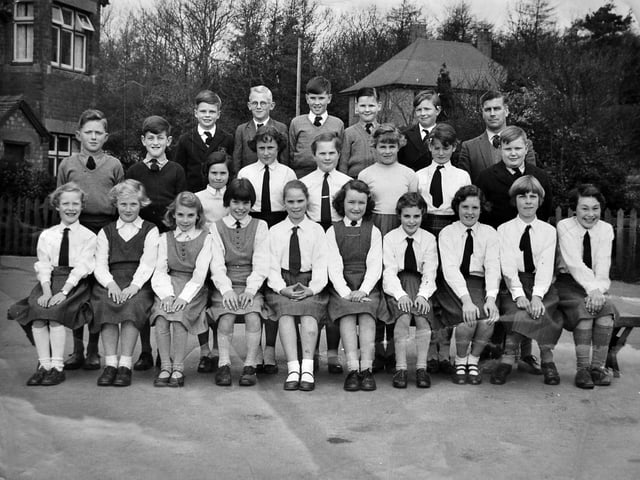 Cheswardine County Primary School’s top class, circa 1960–61. A handwritten note with the photograph recalls that all the children lived within the parish or a 2.3-mile radius of the school. The image lists pupils alongside their headmaster, Mr Thomas, with names recorded as follows: Back row: Roger Beeston, Ken Lainton, John Ball, Richard Lunt, Robert Madders, Mr Thomas (headmaster). Middle row: Paul Wright, Bryan Loynton, Elizabeth Nagginton, Pauline Humes, Sylvia Foster, Elizabeth Healy, Jennifer Parsons, Ian Forrester. Front row: Annette Taylor, Dot Wassal, Pat Hoole, Jean Simpson, Pauline Baggott, Sara Madders, Angela Griffiths, Linda Parsons, Audrey Lea, Georgina Cooper, Gina Llewellyn.