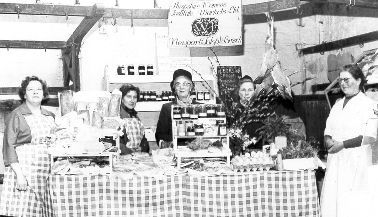 A nostalgic look back to Newport in 1961, when the Women’s Institute ran a market stall in the town’s Indoor Market. Now known as Newport Country Market, the stall has since marked over 50 years in the community. Seen here from left are Mrs Lea (assistant controller), Mrs Williamson (secretary), Mrs Miller (controller), Mrs Rugman (treasurer) and Mrs Vallings (committee member), proudly representing the Newport WI. The stall carried the sign “Shropshire Women’s Institute Markets Ltd”, reflecting a long-standing tradition of local produce and community enterprise.