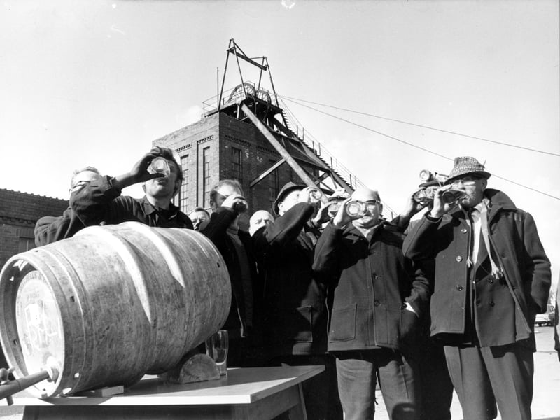 Primrose Hill Colliery after closure, George Prince, the colliery manager C Shaw and training officer Jack Kielty had a drink with the miners who had worked their last shift. The previous week the pit had broken the record for production. Its closure was marked with barrels of free beer for the miners. Pictured in March 1970.