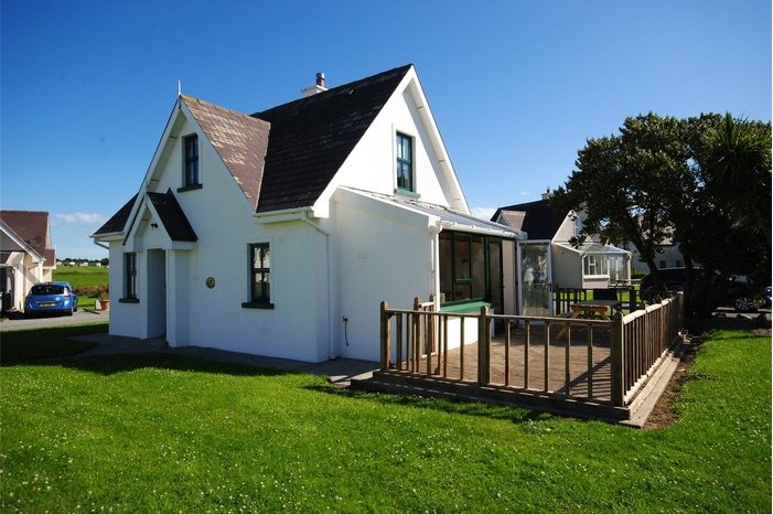Fancy owning your holiday getaway with sea views? This homely three-bed property on the Hook Penisula could be just what you're looking for.