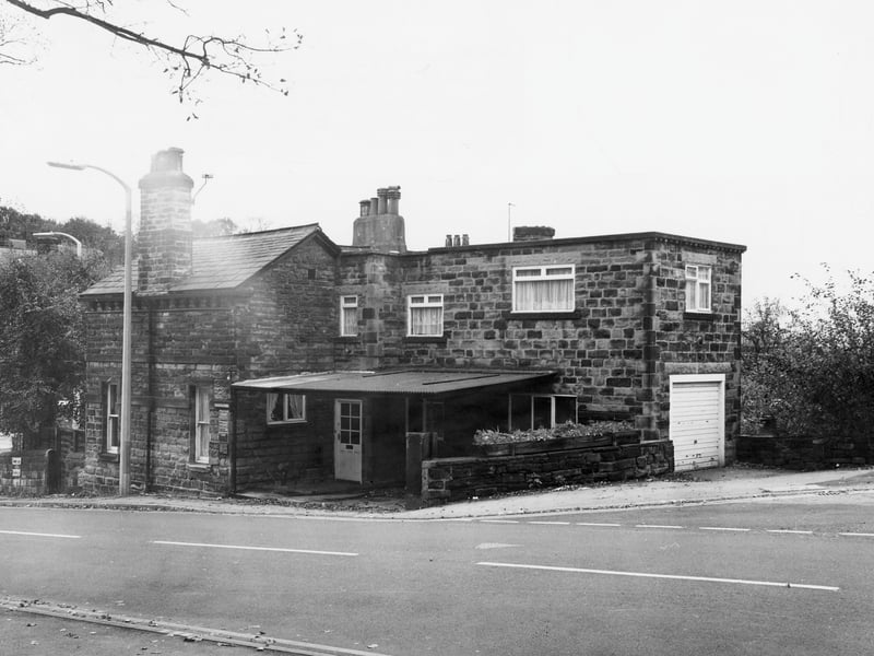 Gledhow Lane by the junction with Fitzroy Drive, seen on the right. The building shown is a surgery which faces onto Roundhay Road, just visible on the left of the picture, and is numbered 665 Roundhay Road. Pictured in November 1984.