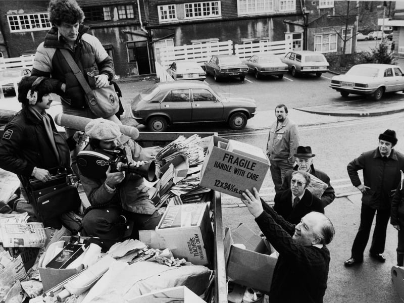 A BBC film crew clambered into a skip piled high with waste paper to the amazement of shoppers at Safeways Oakwood store in January 1980. The crew were filming the monthly waste appear collection in the car park for a BBC Horizon documentary.