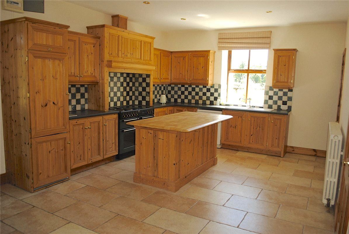 Inside the property is immaculate throughout with all the main rooms on the ground floor being the width of the house. The kitchen is at the heart of the property and has solid pine fitted units with a matching island.