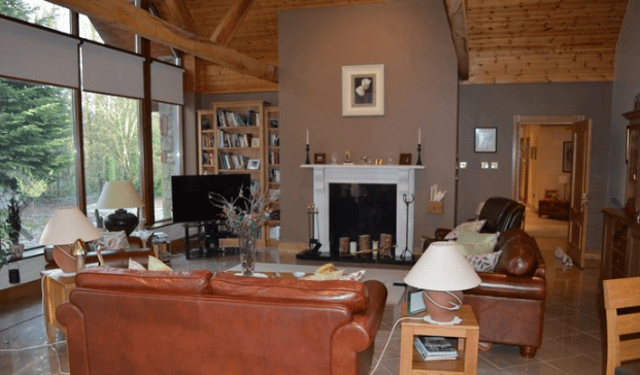 The main house boasts four bedrooms, three bathrooms and the latest in modern living with unique ceiling height windows and rear decking.