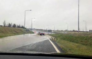 The slip road from the M9 northbound to the N78 Athy Road is flooded (above).