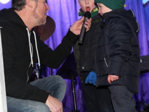 [caption id="attachment_136184" align="alignnone" width="300"] Mason and Alex get up on stage to sing Christmas Carols[/caption]