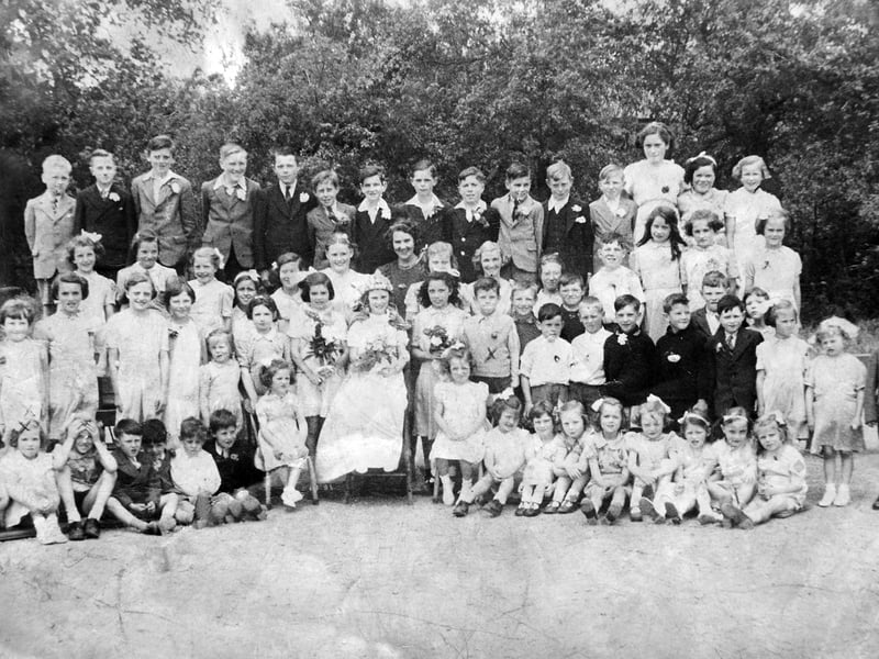 Weston Lullingfields School May Day, 1943. This photograph was shared by Mrs Betty Molyneux, who was known at the time as Betty Hartley. Betty recalls being evacuated from Liverpool to Shropshire in 1941 with her family, eventually settling in Weston Lullingfields. She is pictured here with her brother Alan among the schoolchildren and teachers. She remembers: “I am sitting second from the left. My brother Alan is there too, and our mother marked us with crosses. The teachers included Miss Halfpenny and Miss Rogers.”