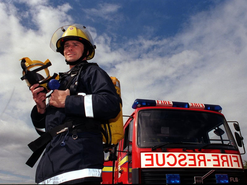 Selby fire fighter Andrew Jakeman with the breathing apparatus he used to rescue a child from a car in a lake. Pictured in September 1998.