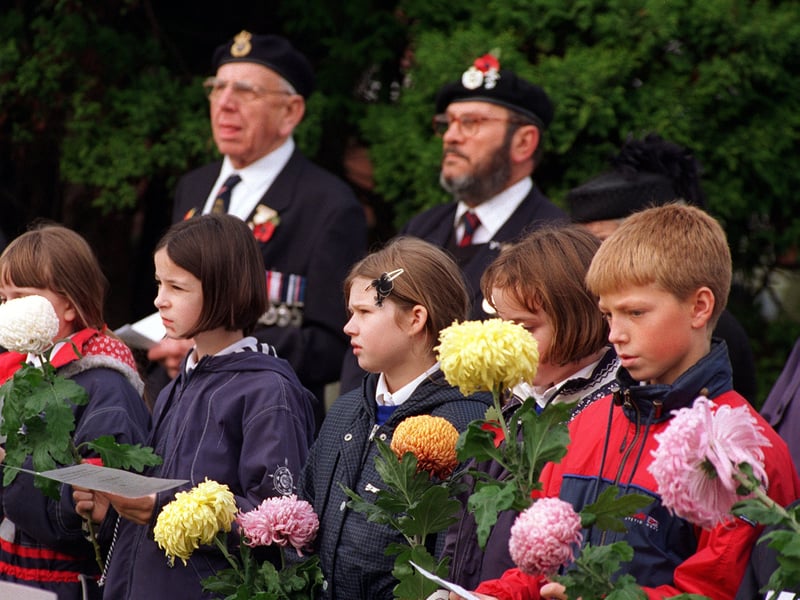 Pupils from St.Mary's RC School with veterans at the dedication of the town's  30 commonwealth  War Graves in November 1997.