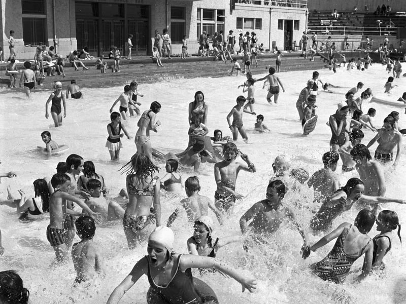 Families enjoy the summer sunshine at Portobello open-air swimming pool, near Edinburgh, in July 1971