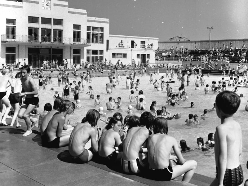Children sitting on the steps of Portobello open-air pool, Edinburgh, in July 1972