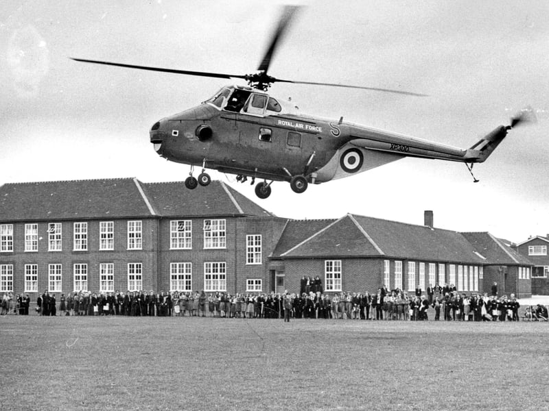 A Royal Air Force helicopter lands at Kingswinford Secondary School during a recruiting display on September 30, 1975, watched by crowds gathered in the distance. It must have been quite a sight for pupils and local residents to see a helicopter arrive at their school. Do you remember this RAF display, or watching the helicopter land?
