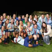 The Salthill Devon squad celebrates after the cup presentation.