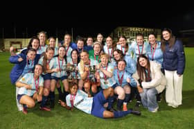 The Salthill Devon squad celebrates after the cup presentation.