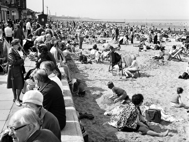 Children and families enjoy the May sunshine on the beach and promenade at Portobello in 1975