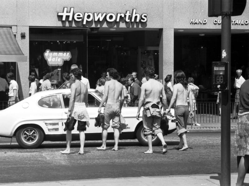 Four teenagers try to stay cool as they cross Princes Street, Edinburgh, during the long hot summer of 1976.