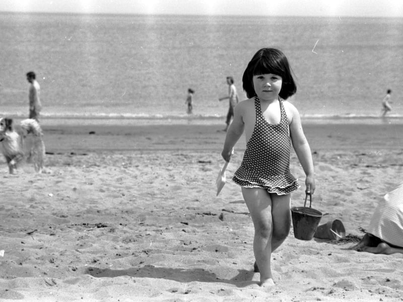 A little girl with her bucket and spade on Portobello beach in May 1975