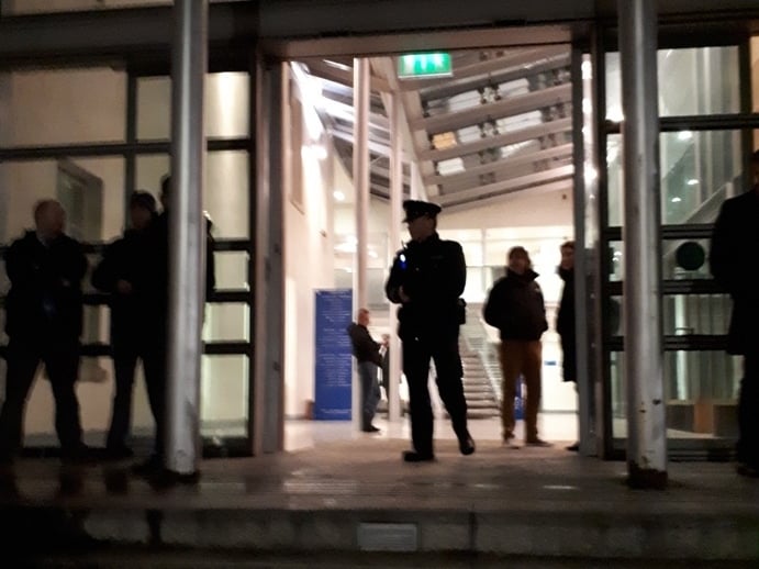 Above: Waiting for gardai to arrive and escort murder suspect Mohamed Morei into Dundalk District Court for a special sitting on January 4 just before 7pm