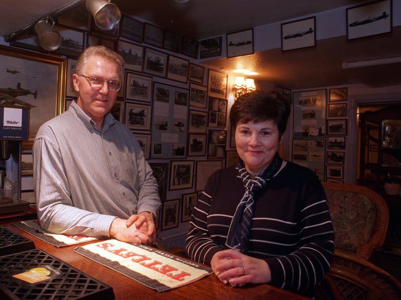 Stewart and Janet Hurst in the lounge of their pub, The Bombers, at Seaton Ross in November 1997 surrounded by a photographic history of the RAF in the area.