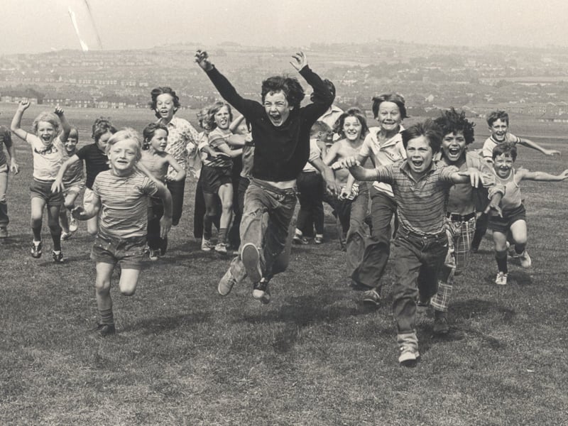 Children having fun at the park in Parson Cross, Sheffield, in August 1975