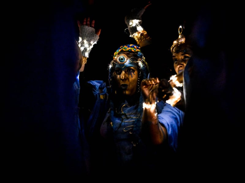 Various characters help guide the procession