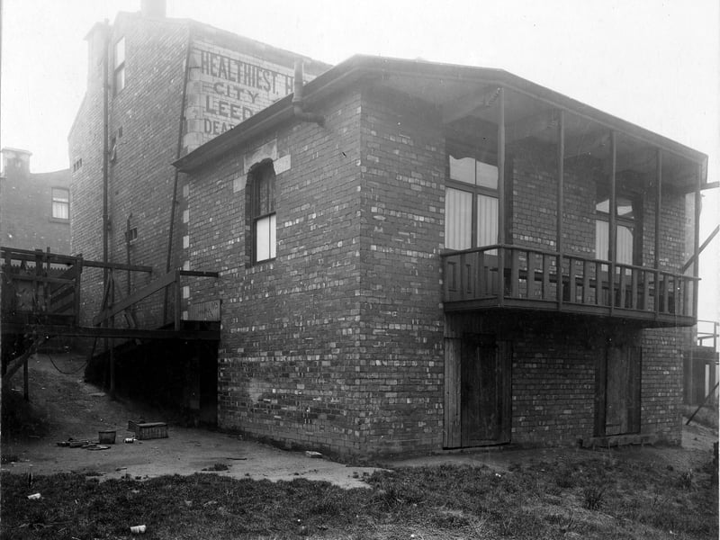 Burley Working Men's Club, numbers 5 and 7 Cross Cardigan Mount, the secretary Ernest Cowell. This view is of the back, with extension, which includes a verandah. On the left side is an access ramp. Pictured in November 1907.