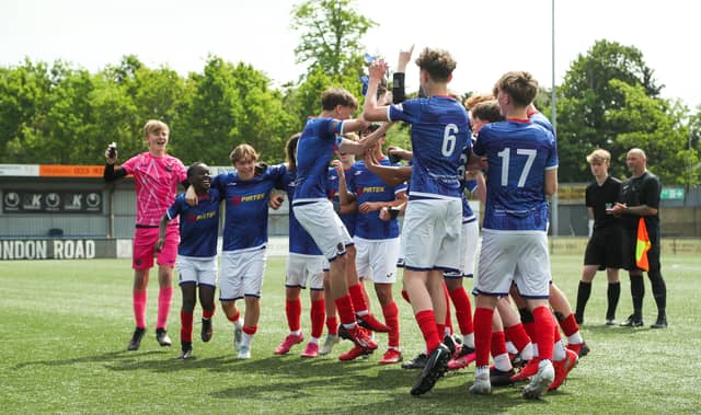 The Titchfield Youth players celebrate their win against Portsville Park Rockets in the under-14 Memorial Challenge Cup Final at Westleigh Park