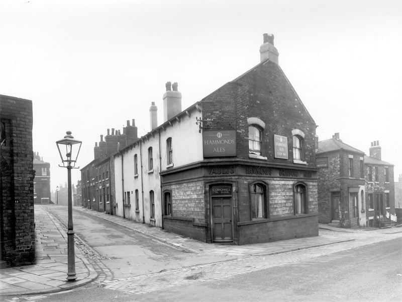 Dolly Lane and the public house seen is the Tulip Inn. Over the door there is the word 'vaults' which would mean that the pub had cellar storage for the kegs of ale below. The landlord at this time this photo was taken in August 1958 was Clifford Cracknell.