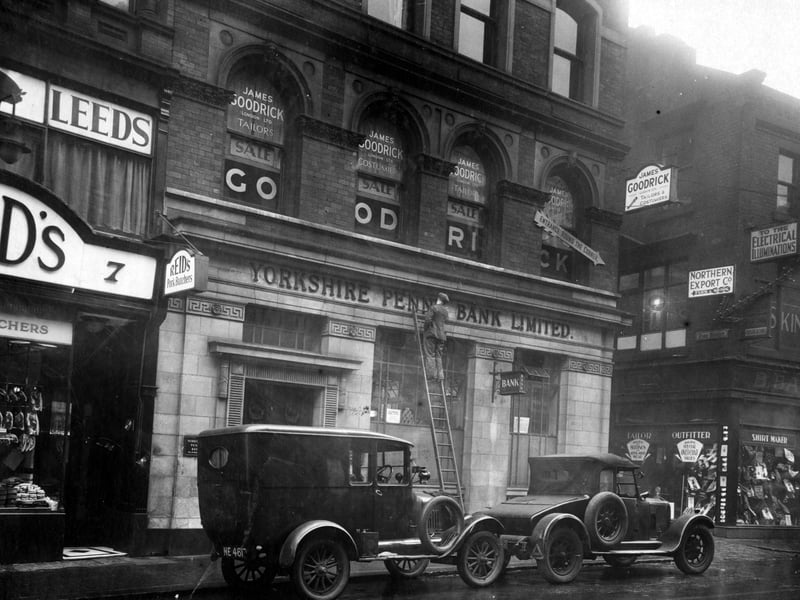 Kirkgate, showing Reid's Pork Butcher at number 7, Yorkshire Penny Bank at numbers 8 & 9, James Goodrick, tailors, with a sale, and then Fish Street. Northern Export Co, furriers, are on the next corner. Pictured in December 1930.