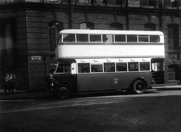 A Crossley 64 double decker bus parked outside the Leeds City Transport Offices on Concordia Street.