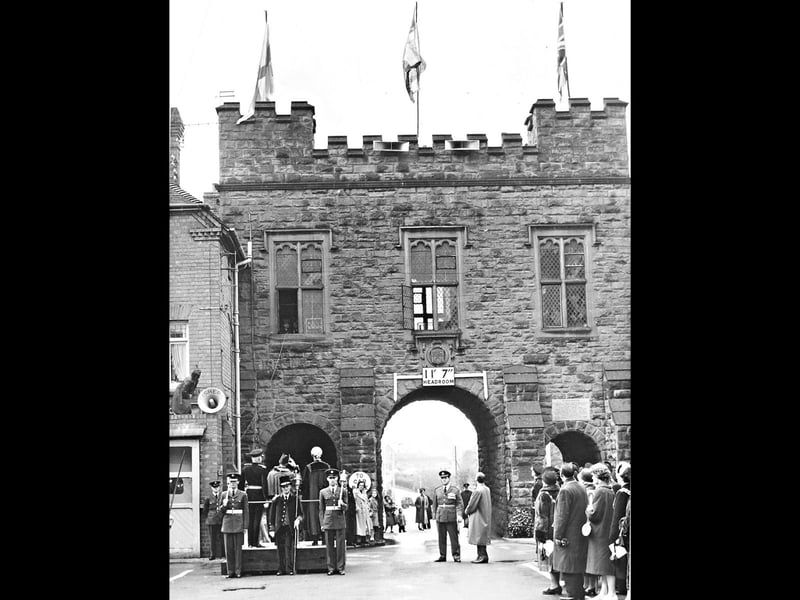 April 1959, the original caption reads: 'Bridgnorth yesterday received letters patent, authorising the use of a coat of arms for the borough, from the Lord Lieutenant of Shropshire, Viscount Bridgeman. Here a banner with the coat of arms on it, is seen unfurled at the North Gate.'