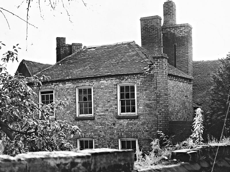 The original caption of the September 1956 reads: 'Dirty and deserted behind its defence of overgrown trees, Bridgnorth's Jacobean Cann Hall stands forgotten. Soon it must come down to ease traffic conditions.'