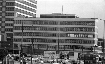 The Merrion Centre during the final stages of its construction. View looks from Woodhouse Lane. On the left edge, part of the Odeon Cinema can be seen.