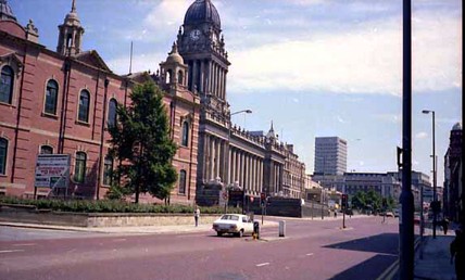 On the left of this view is the Oxford Place Methodist Chapel, built of red brick with contrasting stone ornamentation. Westgate is visible in the foreground, becoming The Headrow after the junction with Oxford Place.