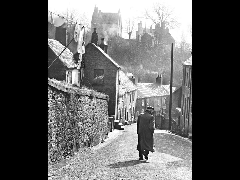 An atmospheric view looking down Railway Street, pictured in March 1966.