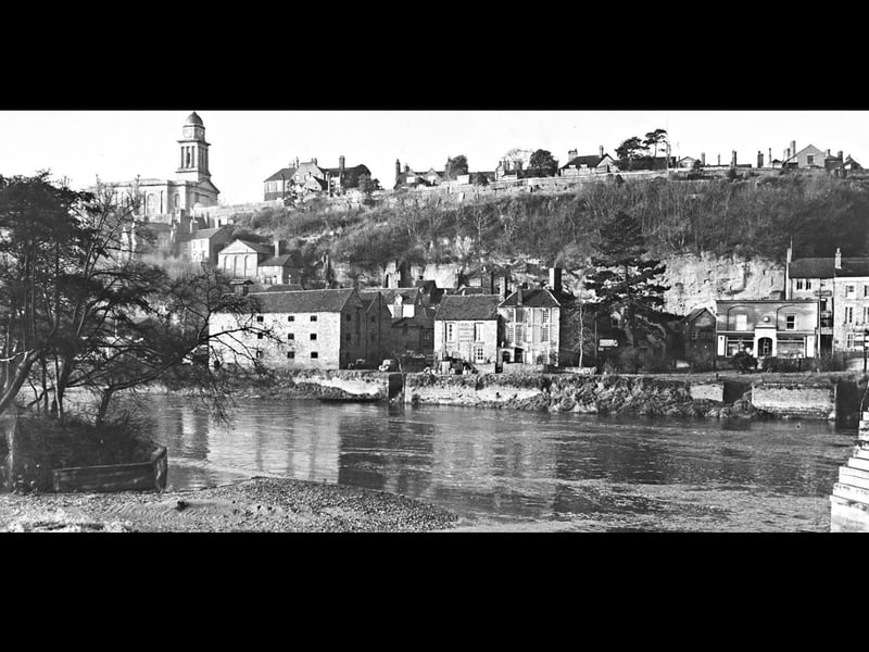 A view across the River Severn towards High Town in the distance, pictured in December 1953.