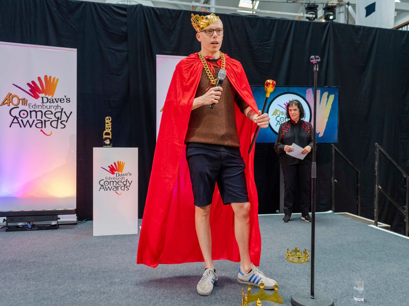 Officially the longest-reigning Edinburgh Comedy Award winner of all time (he won in 2019 before the global pandemic led to a three year break before the prize was awarded again), Jordan Brookes is back in Edinburgh with his new show called 'The Part of You That's Always Screaming'. "The award-winning Elvis of comedy continues his residency at the gates of Hell, with a new show inspired by an absolutely shocking incident on a train. Have you ever felt seen and unseen at the same time? Have you ever wondered what's lurking just in the corner of your vision? Yeah me too, what is that? What IS that??". See him at the Pleasance Dome from August 5-30.