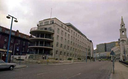 This view looks up Calverley Street in the direction of Leeds Metropolitan University. On the left is the entrance to Portland Street and the Brotherton Wing of Leeds General Infirmary which was added to existing buildings in the 1930s. On the right edge, part of the Civic Hall is visible.