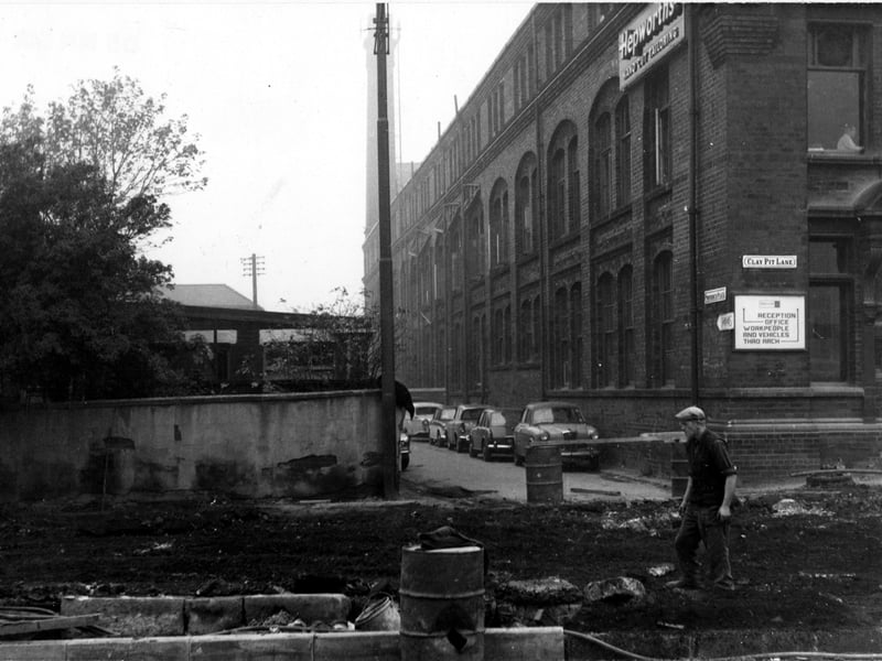 Looking north-west along Providence Place from Clay Pit Lane. On the right is J. Hepworth & Son Ltd., clothes manufacturers, in Providence Works. Cars are parked along Providence Place. Pictured in November 1968.
