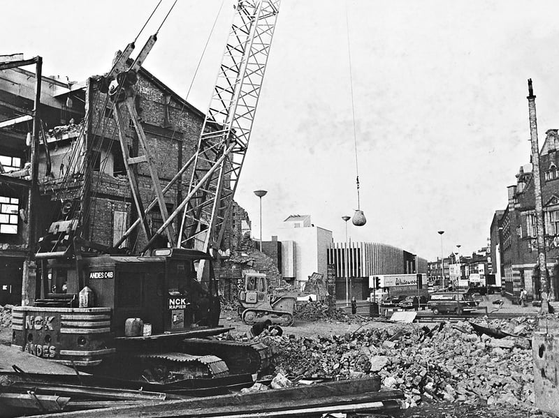 A heavy wrecking ball hangs suspended from a crane as bulldozers clear mounds of shattered brick and twisted metal in October 1974. Once celebrated as a sumptuous, glittering entertainment palace that drew thousands of picture-goers to watch stars from Greta Garbo and Clark Gable to Robert Redford, the Gaumont cinema was brought down to make way for modern offices and showroom developments. The bittersweet scene captured the rapidly changing skyline of central Wolverhampton during the 1970s redevelopment boom. Did you ever queue up to watch the big picture at the Gaumont before its grand silver screen was lost to the wrecking ball in 1974?