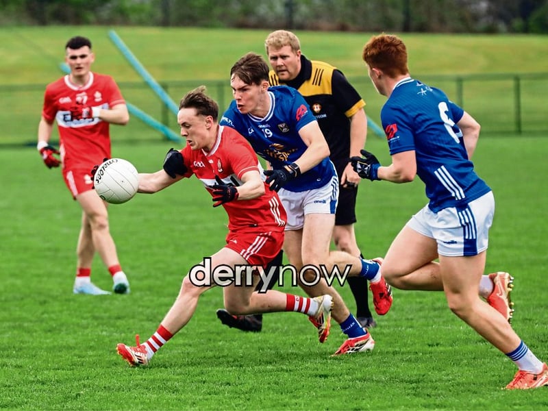 Derry’s Lorcan Higgins pushes forward with the ball.