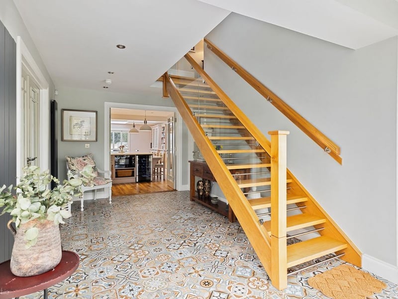 Amberley, Newtown, Celbridge has come on the market with a price tag of €1,275,000. This exquisite five bedroom detached family home is set on 1.81 acres of rolling Kildare countryside. This stunning and energy efficient smart home is superbly located on Liffey View Road, Newtown, Celbridge in one of the most sought after residential locations in Kildare. Set back from the road in a peaceful and immaculately manicured country setting, Amberley is accessed through electronic gates and a sweeping driveway provides both seclusion and privacy. This exceptionally spacious and elegant family home extends to 3,250 sq. ft of expansive and light filled accommodation and has been remodeled and upgraded several times to an exceptional build specification and finish. READ MORE: Great news as plans for new Lidl in Kildare The expansive open plan kitchen with its split-level bespoke feature island, spacious dining area and sitting area is the focal point of this stunning home. The bespoke hand crafted kitchen with floor to ceiling cabinetry and high-end appliances is filled with an abundance of natural light and 2 sets of “lift to slide” doors open out to a delightful, enclosed patio area. The spacious utility and boot room is both exquisitely designed and exceptionally functional. The ground floor also features two impressive reception rooms, one of which is currently used as a master bedroom suite with walk-in wardrobe and an en-suite. Accommodation on the first floor includes 5 perfectly proportioned and beautifully styled bedrooms, four of which are en-suite. Amberley is minutes away from the bustling town of Celbridge with its wealth of amenities and services. The charming village of Ardclough and the country retreat of Lyons Estate are also on it’s door step. This truly magnificent residence offers the discerning buyer a country, tranquil lifestyle with immediate access to a bustling town on one side and a quaint village on the other and its strategic proximity to the M4 and M7 means you will be in