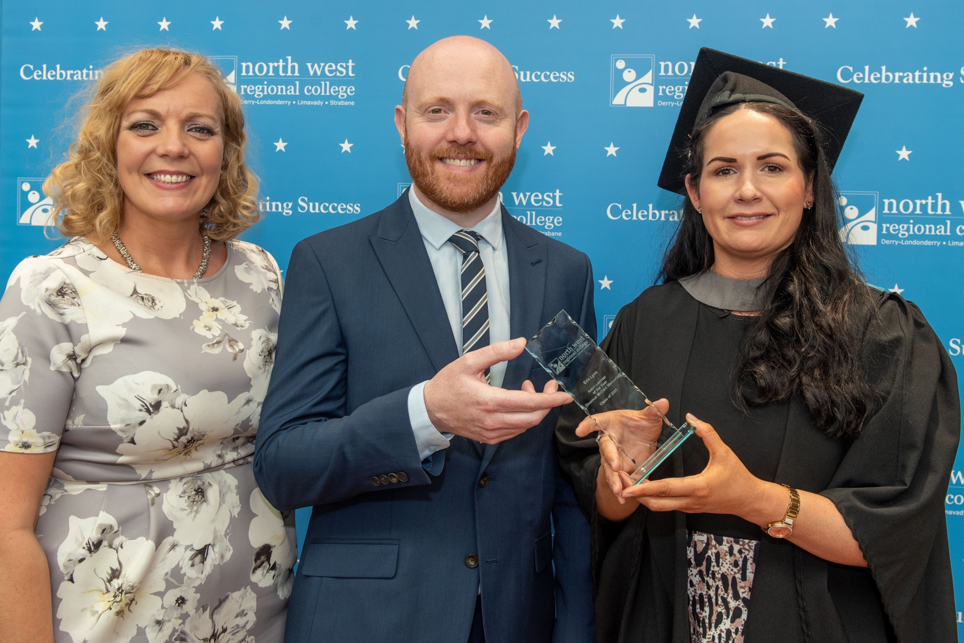 Above: NWRC's Business Skills Manager Sinead Hawkins presents the award in memory of her father Seamus McCaul for the Access Diploma in Combined Studies Adult Learner of the Year to Erin Lynn, from Dungiven, also pictured is event MC Barra Best.  County Derry students were among those who recently celebrated their graduation at North West Regional College.